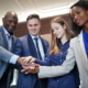A diverse group coming together as a team during a business meeting